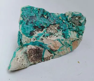 Chrysocolla cut into domes and dice and polygons are common